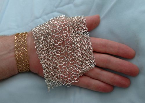 Combination of two sizes in knotted chain mail.