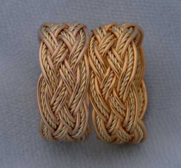 Two rings, each with a green twisted inner strand.