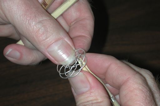 Working on an earring.