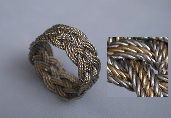Five-lead, eleven-bight, all twisted platinum and 18K.