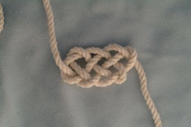 Five-part chain knot, four loops.