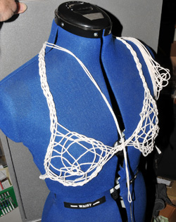 Knot tied with a single pass of cotton twine.