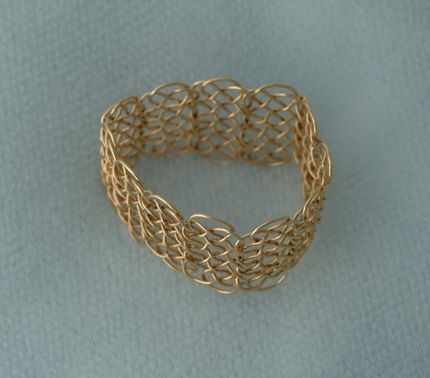 Knotted chain ring, 12 3-loop prolong knots, loose.