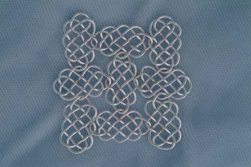 Knotted Chain-mail, tiled 3-loop Prolong Knots.