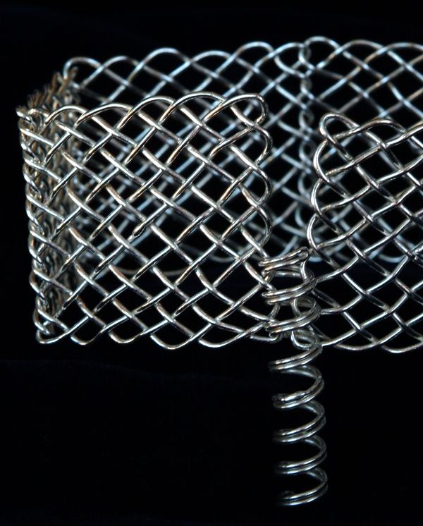 Celtic panel bracelet spiral clasp partly engaged.