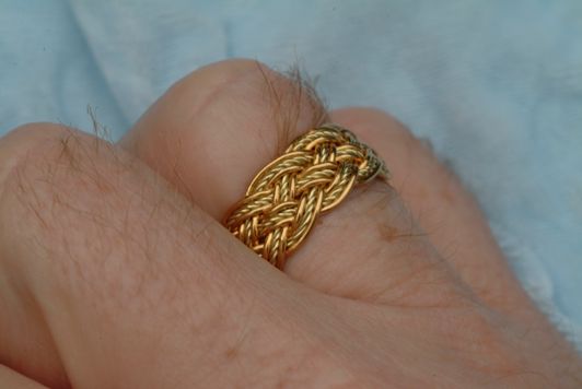 PureGold and 18K green ring on hand.